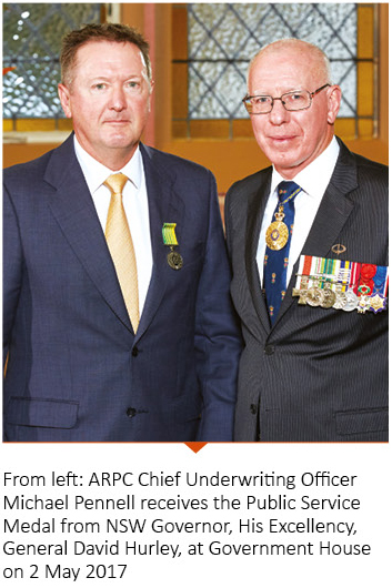 Photo of ARPC Chief Underwriting Officer Michael Pennel recieving the Public Service Medal from the NSW Governer, His Excellency General David Hurley